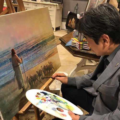 Yongsung Kim painting a piece of artwork